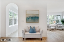 An elegant, tall entrance arch greets you as you enter this stunning home!