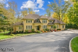 Belgian Block driveway leads down the the 3 Car garage and extra parking