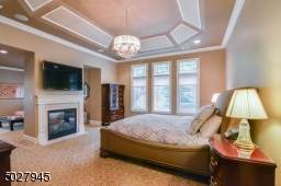 17'8" x 15' Tray ceiling with detailed moulding, crown moulding, american brass & crystal chandelier, 2 sided fireplace with marble hearth and surround/custom wood mantle, wall mounted TV, Private Terrace overlooks pool