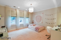 15' x 15' Recessed lighting, chandelier, walk-in closet with custom closet system, wall to wall carpet, en suite bath custom vanity with marble countertop, tumbled marble floor to ceiling shower, dark and light emperador marble tile floor