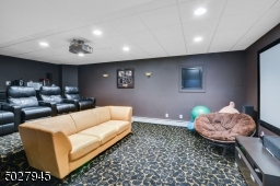 24'6"x 15'10" Recessed lighting, 4 up light wall sconces, multi-level JVC Hi Definition Projector/ 120" projection screen, full surround sound, DVD/Xbox, Satellite TV & WiFi System, 4 leather recliners/built-in food trays
