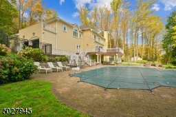 Landscape sprinkler system, heated gunite pool/custom designed by national pool/ 38,000 gallon/ paver decking