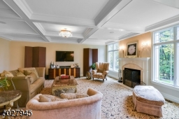 22'8" x 18'4" Coffered Ceiling, American Brass & Crystal Chandelier and sconces, wood burning fireplace with travertine surround and custom wood mantel, Kane wool carpeting