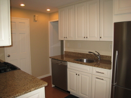 VIEW OF KITCHEN FROM DINING ROOM