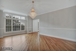 Oversized Window, Hardwood Floors with Border Inlay, Crown Molding