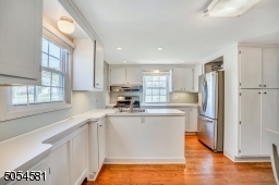 Kitchen fits perfect with this charming cape-style home.