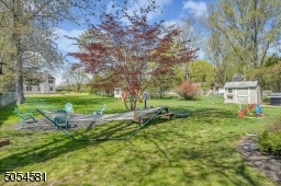 Spacious Backyard with 2 storage sheds!