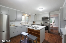 Window over the sink to view the yard & stainless steel appliances