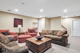 Large basement with recreation room, second laundry room, exercise room and full bath.
