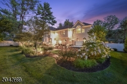 Idyllic setting, fully fenced in backyard with lush landscaping.