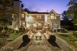 Bluestone Patio with built in fire pit at dusk.