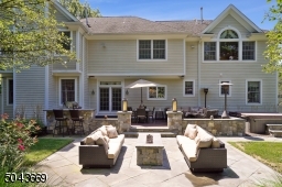 Large deck leading to bluestone patio with built in firepit.