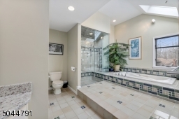 With two vanities, a jetted tub and steam shower, you'll never want to leave!