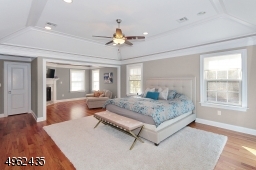 Spacious master bedroom featuring a sitting rm w/gas fp, tray ceiling, his & her custom walk-in closets and elegant bath (his & her sep vanity), spa like shower & soaking tub!