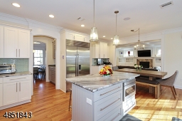 Butlers pantry, wine cooler, walk-in dry pantry, mudrm & access out to garage