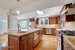 Center Island with elegant Glass Pendent Lighting.