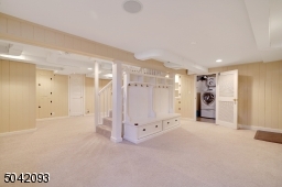 Carpet and Recess Lighting provide a warm feel to the large Finished Basement.