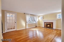 Formal Living Room includes gas fireplace and large bay window for added light. Crown molding compliment this cozy living space!