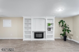 In the basement. With electric fireplace and full bathroom.