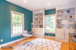 First floor office or optional 6th bedroom with charming built-ins and recessed lighting  conveniently located next to private first floor full bath, additional powder room on first floor for guests