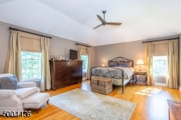 Master Suite with Tray Ceilings, an additional sitting room or second office with french doors for privacy, and his & hers walk in closets