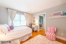 This bedroom features a closet and dressing area,  also opens to the Jack & Jill full bathroom