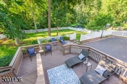 Double Tiered Deck overlooking fully fenced grassy level yard area