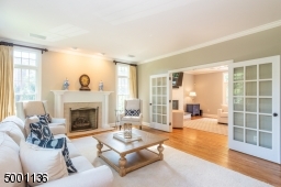 Formal living room facing the family room, flooded with natural light