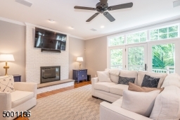 Family Room with wood burning FP, open to eat-in Kitchen with doors to deck, allowing a great flow for entertaining guests