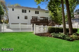 Expansive black top driveway with 2 car garage