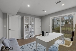 First floor bedroom also virtually staged as a home office.