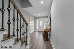 Decorative railings, ring door bell, wifi garage door opener, beautiful wide plank flooring.