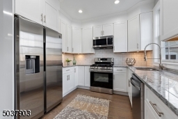 New stainless appliance package with warranty, Moon River Granite countertop, White Shaker Face soft cabinet, custom faucet undermount lighting. Separate breakfast area with  oversize door to balcony for grilling.