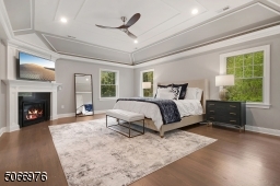 The sumptuous Primary Wing retreat features a vaulted tray ceiling w/ intricate moldings, gas fireplace and large custom walk-in closet plus a luxurious Primary Bathroom