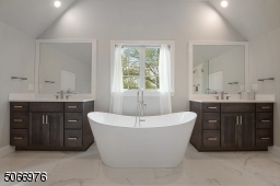 A luxurious Primary Bathroom w/ tray ceiling, two vanities w/ quartz countertops & two built-in linen closets. A crisp white soaking tub and large walk-in frameless glass shower completes this room. All finishes are modern and on trend.