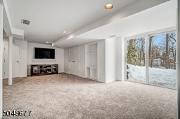Great lower level room perfect for movies or games with slider to yard