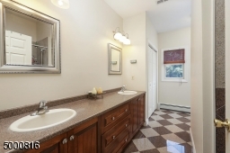 Double sinks, large shower, separate linen closet (there is another linen closet in the hall)