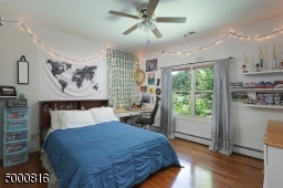 Hardwood floors, lighted ceiling fan and double closet