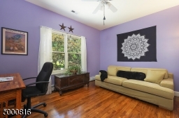 Currently used as an office; hardwood floors, lighted ceiling fan and double closet