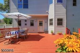 Large sunny deck for entertaining and container gardening.