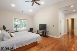 Note the recessed lights and ceiling fan