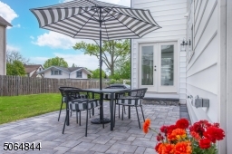 Backyard patio off kitchen and double doors from dining room