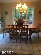 Adjacent to the kitchen.