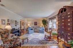 Living room is 13'.4' x 23'.3' with bay window and oak flooring throughout the house.