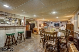 Recreation room is 25'.4" x 32' with a bar area of 6'.6" x 7'.5".Electric heat in basement.
