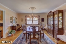 Formal dining room is 13' x 14" with oak flooring. Chandelier is to be replaced. Central vacuum connection.