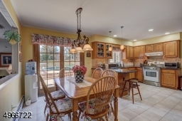 Eat-in Kitchen is 13'. 19'.5". Sliders leading to double tier trex deck.