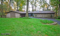 Stone and brick exterior reveals quality of construction of this custom home.