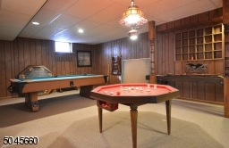 With a mirrored wall for current exercise area, this large room could become a fabulous media room.   .