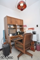 Backing up to the half bath, this cozy room could be an expansion area to add a shower or tub.
